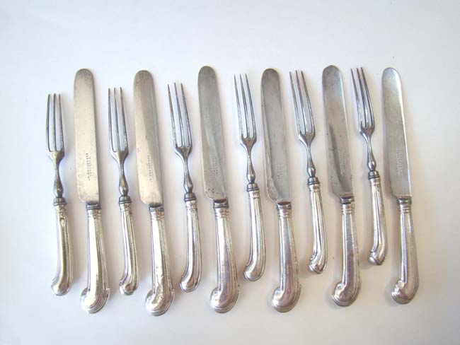A set of Six Irish Silver Fruit Forks circa 1750 and Six English Silver Fruit Knives circa 1860